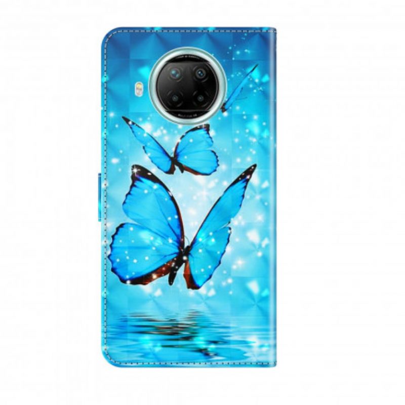 Custodia in pelle Xiaomi Redmi Note 9 Pro 5G Punto Luminoso Farfalle Blu Volanti
