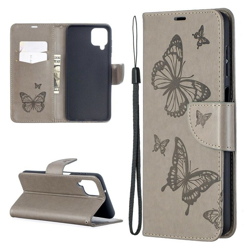 Custodia in pelle Samsung Galaxy M12 / A12 Farfalle In Volo Con Cordino