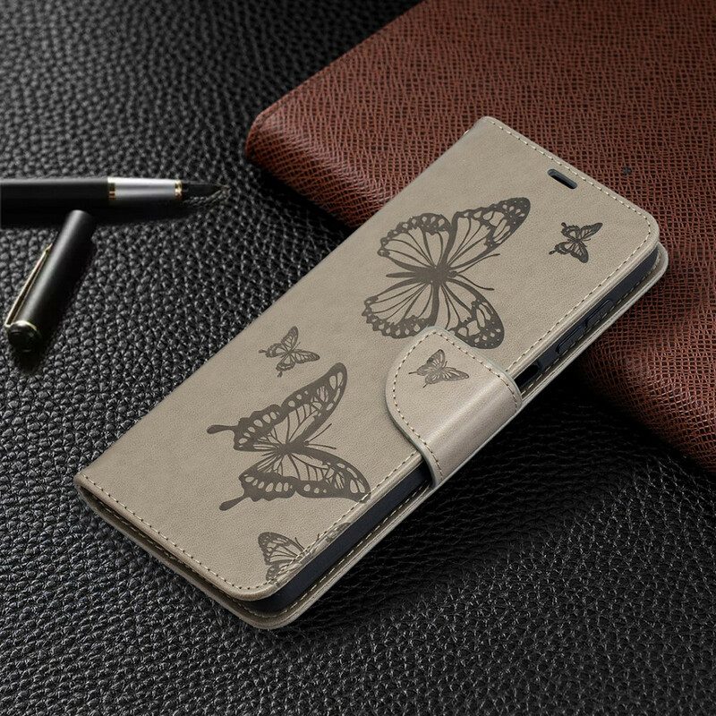 Custodia in pelle Samsung Galaxy M12 / A12 Farfalle In Volo Con Cordino