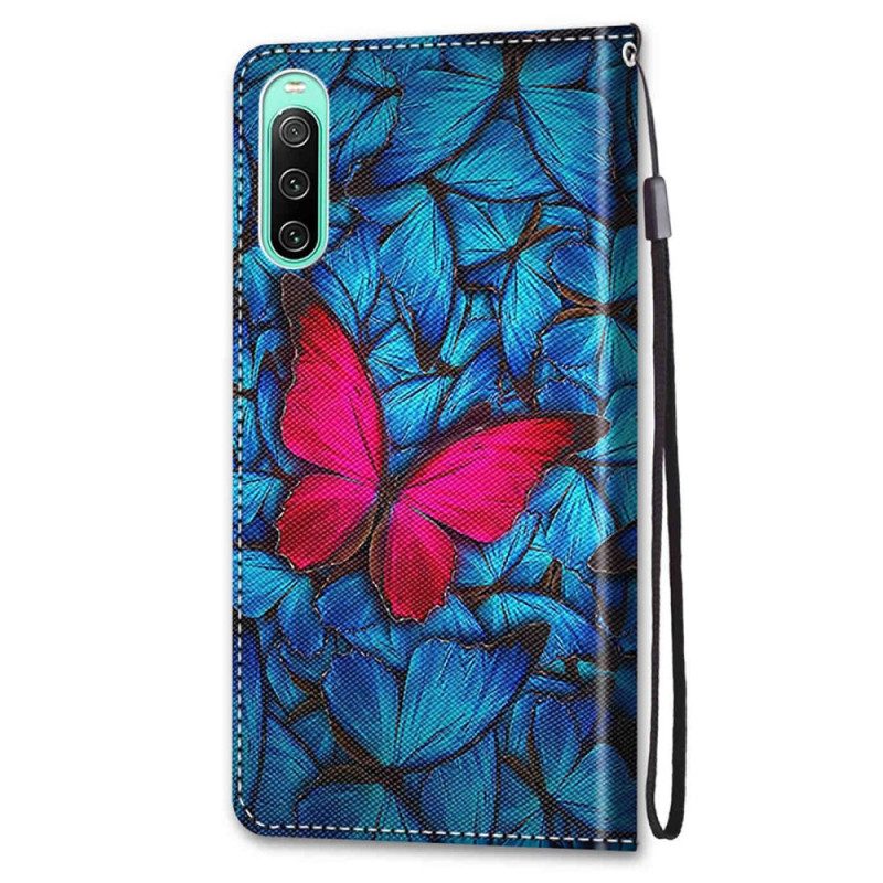 Custodia in pelle Sony Xperia 10 IV Farfalla Rossa Sfondo Blu